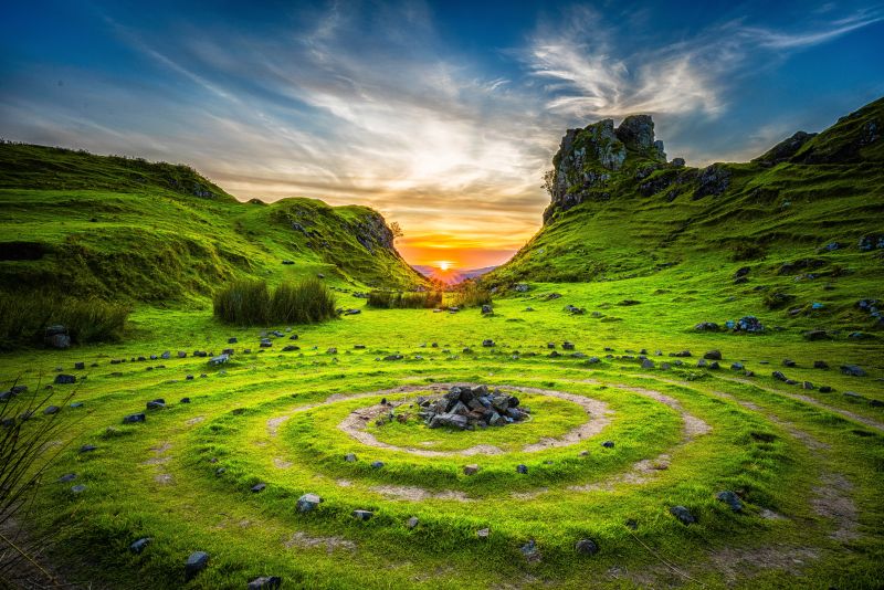 Ancient stone ring on the grass hilly landscape